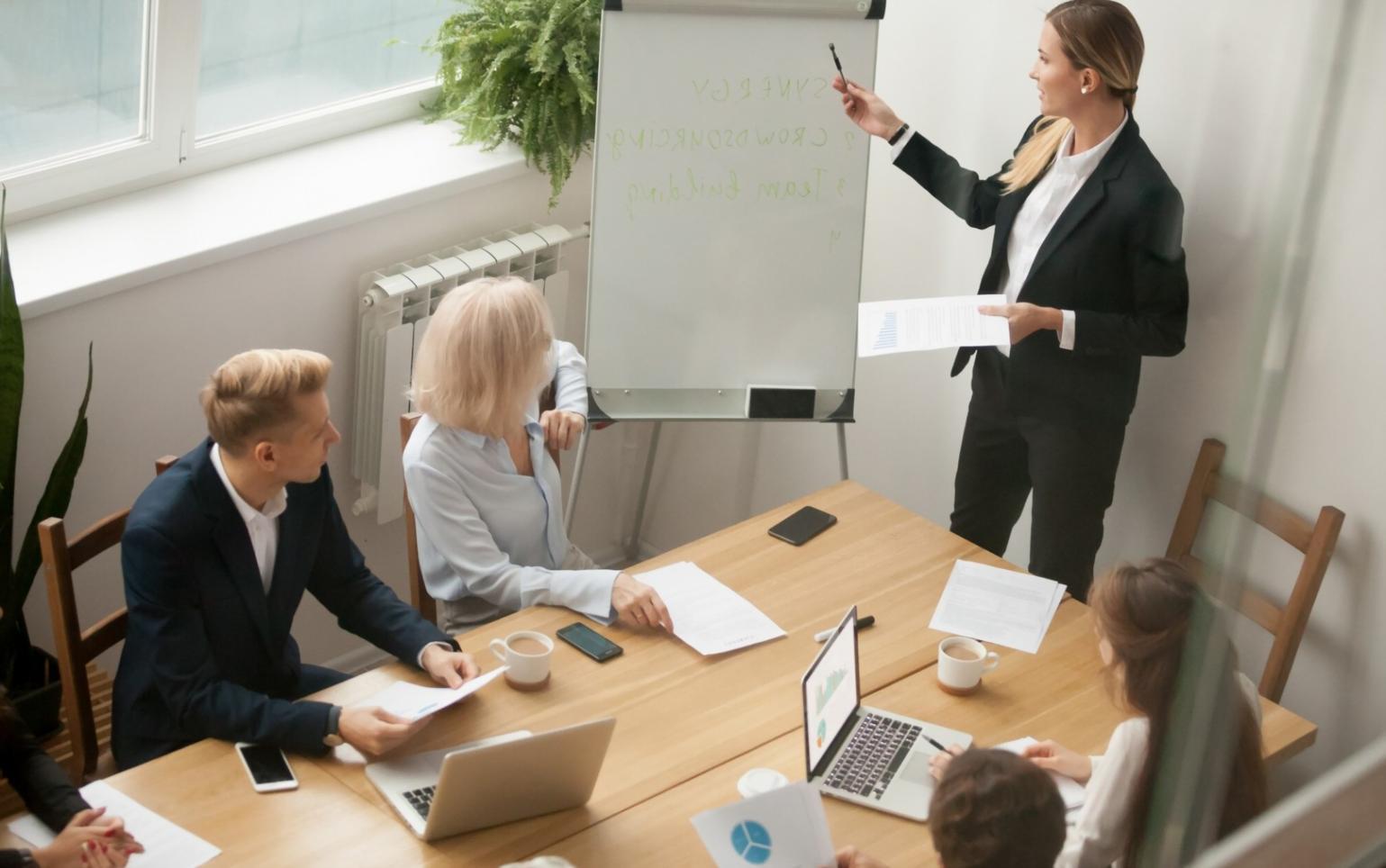 Participant working through financial recovery exercises in classroom setting